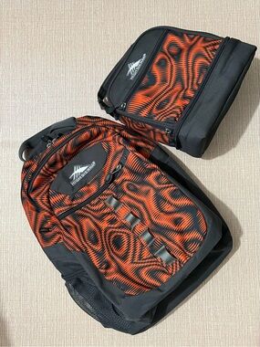 High Sierra Black and Orange Patterned Backpack with Matching Lunch Bag